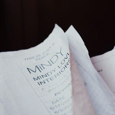A plain white sheet of paper lying flat on a surface.